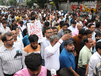 Medical students and doctors are attending a protest rally against the rape and murder of a PGT woman doctor at Government-run R G Kar Medic...