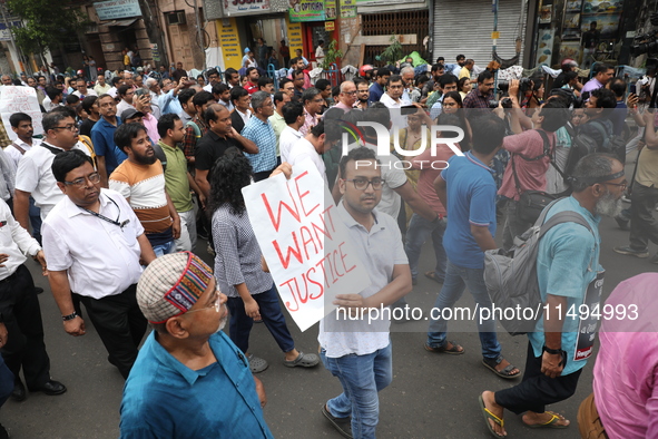 Medical students and doctors are attending a protest rally against the rape and murder of a PGT woman doctor at Government-run R G Kar Medic...