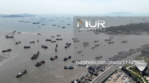 Boats are avoiding Typhoon Jongdari at Shenjiamen fishing port in Zhoushan city, Zhejiang province, China, on August 20, 2024. 