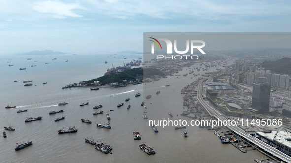 Boats are avoiding Typhoon Jongdari at Shenjiamen fishing port in Zhoushan city, Zhejiang province, China, on August 20, 2024. 