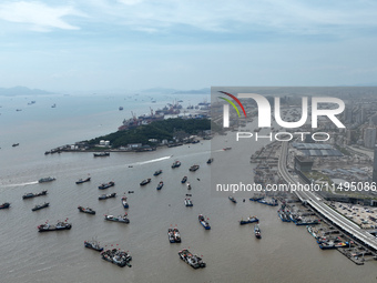 Boats are avoiding Typhoon Jongdari at Shenjiamen fishing port in Zhoushan city, Zhejiang province, China, on August 20, 2024. (