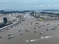 Boats are avoiding Typhoon Jongdari at Shenjiamen fishing port in Zhoushan city, Zhejiang province, China, on August 20, 2024. (