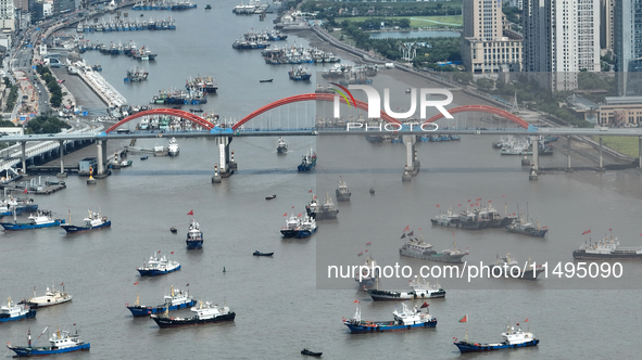 Boats are avoiding Typhoon Jongdari at Shenjiamen fishing port in Zhoushan city, Zhejiang province, China, on August 20, 2024. 