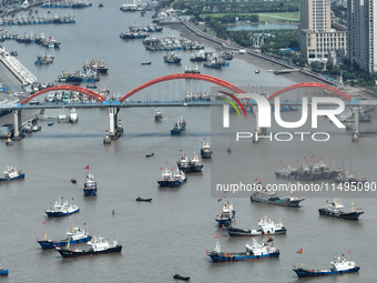 Boats are avoiding Typhoon Jongdari at Shenjiamen fishing port in Zhoushan city, Zhejiang province, China, on August 20, 2024. (