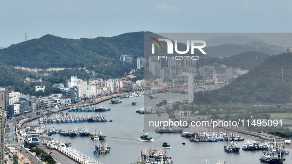 Boats are avoiding Typhoon Jongdari at Shenjiamen fishing port in Zhoushan city, Zhejiang province, China, on August 20, 2024. 