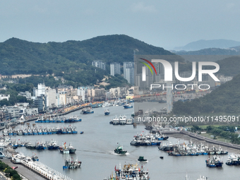 Boats are avoiding Typhoon Jongdari at Shenjiamen fishing port in Zhoushan city, Zhejiang province, China, on August 20, 2024. (