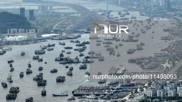 Boats are avoiding Typhoon Jongdari at Shenjiamen fishing port in Zhoushan city, Zhejiang province, China, on August 20, 2024. 