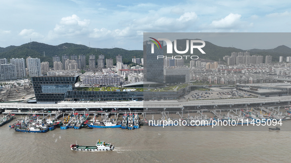 Boats are avoiding Typhoon Jongdari at Shenjiamen fishing port in Zhoushan city, Zhejiang province, China, on August 20, 2024. 