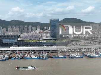 Boats are avoiding Typhoon Jongdari at Shenjiamen fishing port in Zhoushan city, Zhejiang province, China, on August 20, 2024. (