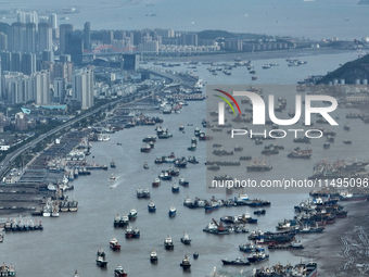 Boats are avoiding Typhoon Jongdari at Shenjiamen fishing port in Zhoushan city, Zhejiang province, China, on August 20, 2024. (