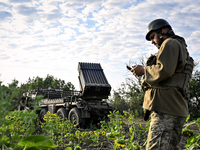 An artilleryman of the 110th Marko Bezruchko Separate Mechanized Brigade who is serving in the Pokrovsk direction is by an RM-70 multiple ro...