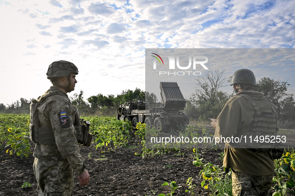 Artillerymen of the 110th Marko Bezruchko Separate Mechanized Brigade who are serving in the Pokrovsk direction are by an RM-70 multiple roc...