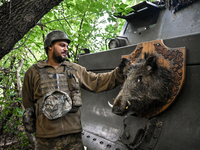 An artilleryman of the 110th Marko Bezruchko Separate Mechanized Brigade who is serving in the Pokrovsk direction is standing by an RM-70 mu...