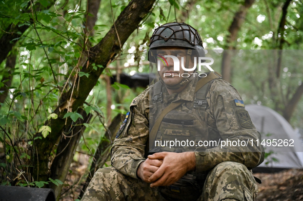 An artilleryman of the 110th Marko Bezruchko Separate Mechanized Brigade is operating an RM-70 multiple rocket launcher in the Pokrovsk dire...