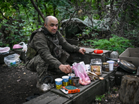 An artilleryman of the 110th Marko Bezruchko Separate Mechanized Brigade is operating an RM-70 multiple rocket launcher in the Pokrovsk dire...