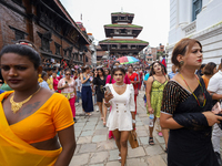 Members of the sexual minority LGBTIQ+ group of Nepal are walking past the Kumari Ghar (left) and Gaddhi Baithak (right) located in Kathmand...