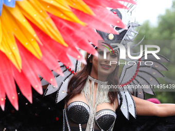 A member of the sexual minority LGBTIQ+ group of Nepal is posing for a photo during the Gaijatra (Pride) parade in Kathmandu, Nepal, on Augu...