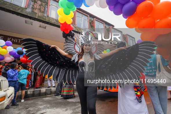 A member of the sexual minority LGBTIQ+ group of Nepal is posing for a photo during the Gaijatra (Pride) parade in Kathmandu, Nepal, on Augu...