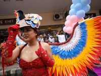 A member of the sexual minority LGBTIQ+ group of Nepal is fixing a mask during the Gaijatra (Pride) parade in Kathmandu, Nepal, on August 20...