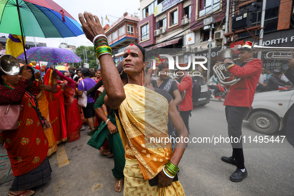 A member of the sexual minority LGBTIQ+ group of Nepal is dancing during the Gaijatra (Pride) parade in Kathmandu, Nepal, on August 20, 2023...