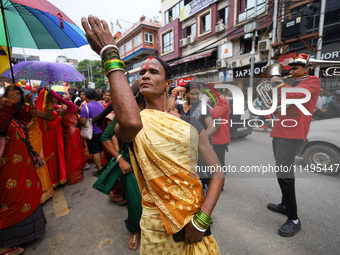 A member of the sexual minority LGBTIQ+ group of Nepal is dancing during the Gaijatra (Pride) parade in Kathmandu, Nepal, on August 20, 2023...