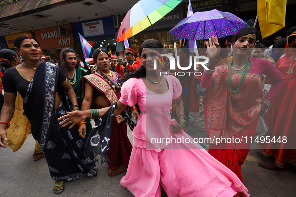 Members of the sexual minority LGBTIQ+ group of Nepal are dancing during the Gaijatra (Pride) parade in Kathmandu, Nepal, on August 20, 2023...