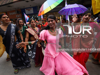 Members of the sexual minority LGBTIQ+ group of Nepal are dancing during the Gaijatra (Pride) parade in Kathmandu, Nepal, on August 20, 2023...