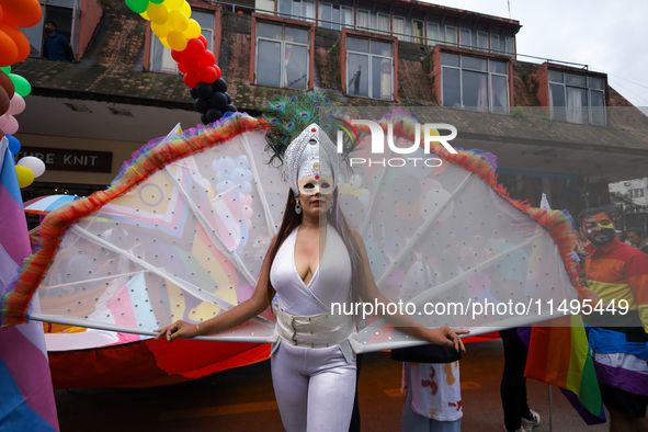 A member of the sexual minority LGBTIQ+ group of Nepal is posing for a photo during the Gaijatra (Pride) parade in Kathmandu, Nepal, on Augu...