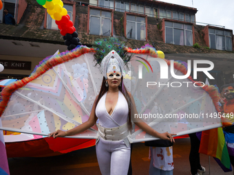 A member of the sexual minority LGBTIQ+ group of Nepal is posing for a photo during the Gaijatra (Pride) parade in Kathmandu, Nepal, on Augu...