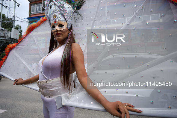 A member of the sexual minority LGBTIQ+ group of Nepal is posing for a photo during the Gaijatra (Pride) parade in Kathmandu, Nepal, on Augu...