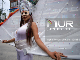 A member of the sexual minority LGBTIQ+ group of Nepal is posing for a photo during the Gaijatra (Pride) parade in Kathmandu, Nepal, on Augu...