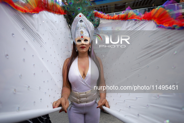 A member of the sexual minority LGBTIQ+ group of Nepal is posing for a photo during the Gaijatra (Pride) parade in Kathmandu, Nepal, on Augu...