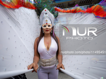 A member of the sexual minority LGBTIQ+ group of Nepal is posing for a photo during the Gaijatra (Pride) parade in Kathmandu, Nepal, on Augu...