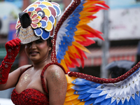 A member of the sexual minority LGBTIQ+ group of Nepal is fixing a mask during the Gaijatra (Pride) parade in Kathmandu, Nepal, on August 20...