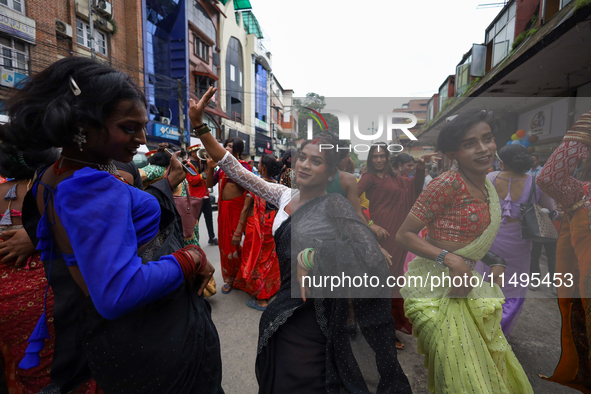 Members of the sexual minority LGBTIQ+ group of Nepal are dancing during the Gaijatra (Pride) parade in Kathmandu, Nepal, on August 20, 2023...