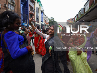 Members of the sexual minority LGBTIQ+ group of Nepal are dancing during the Gaijatra (Pride) parade in Kathmandu, Nepal, on August 20, 2023...