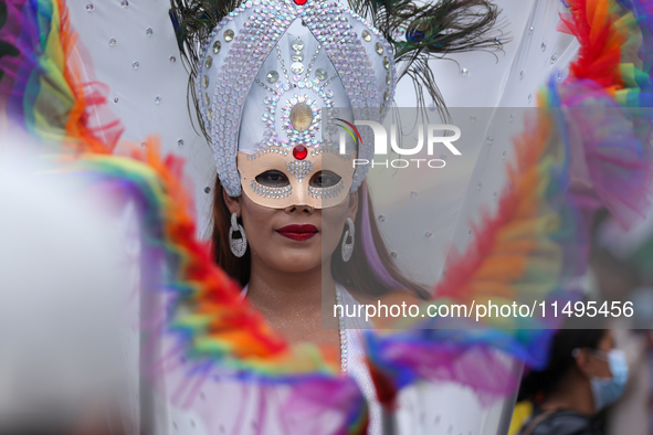 A member of the sexual minority LGBTIQ+ group of Nepal is posing for a photo during the Gaijatra (Pride) parade in Kathmandu, Nepal, on Augu...