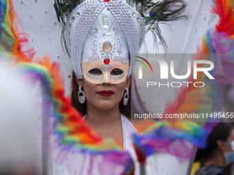 A member of the sexual minority LGBTIQ+ group of Nepal is posing for a photo during the Gaijatra (Pride) parade in Kathmandu, Nepal, on Augu...