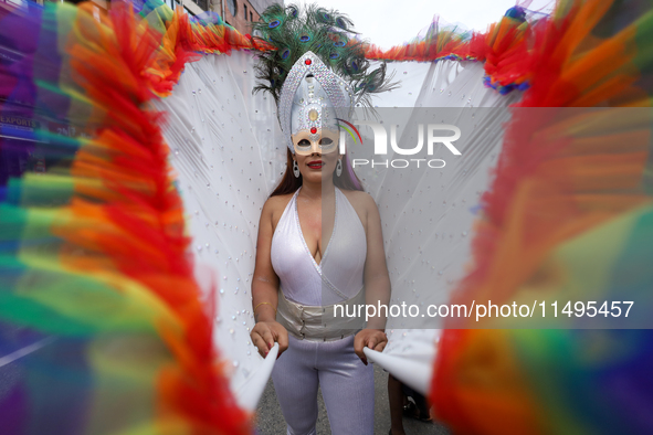 A member of the sexual minority LGBTIQ+ group of Nepal is gesturing during the Gaijatra (Pride) parade in Kathmandu, Nepal, on August 20, 20...