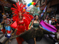 Members of the sexual minority LGBTIQ+ group of Nepal are dancing as they walk through the alleyways during the Gaijatra (Pride) parade in K...