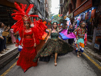 Members of the sexual minority LGBTIQ+ group of Nepal are dancing as they walk through the alleyways during the Gaijatra (Pride) parade in K...