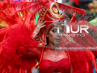 A member of the sexual minority LGBTIQ+ group of Nepal is fixing a mask during the Gaijatra (Pride) parade in Kathmandu, Nepal, on August 20...