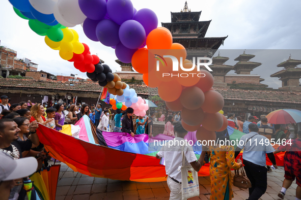 Members of the sexual minority LGBTIQ+ group of Nepal are walking past the Taleju Bhawani Temple located in Kathmandu Durbar Square, a UNESC...