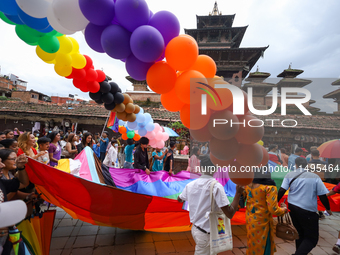 Members of the sexual minority LGBTIQ+ group of Nepal are walking past the Taleju Bhawani Temple located in Kathmandu Durbar Square, a UNESC...