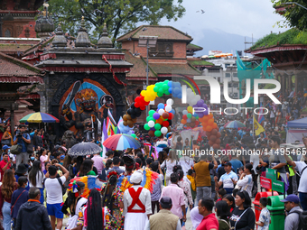 Members of the sexual minority LGBTIQ+ group of Nepal are walking past the Kaal Bhairab statue located in Kathmandu Durbar Square, a UNESCO...