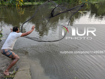 Bangladeshi people suffer from floods during heavy monsoon rains in rural Bangladesh on August 20, 2024. (