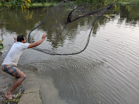 Bangladeshi people suffer from floods during heavy monsoon rains in rural Bangladesh on August 20, 2024. (