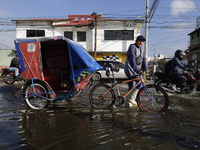 Transporters are circulating on flooded streets in the Colonia Culturas de Mexico in Chalco, State of Mexico, on August 20, 2024, where seve...