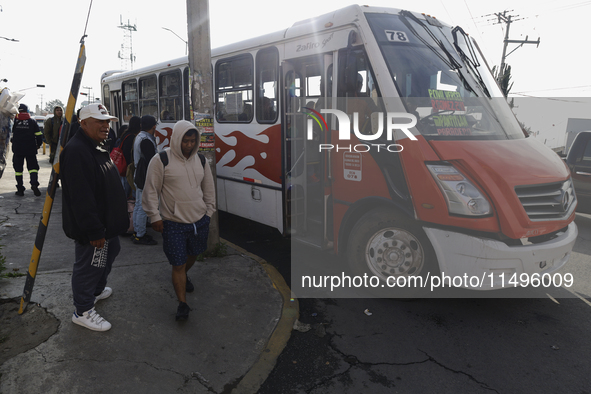 Transporters are circulating on flooded streets in the Colonia Culturas de Mexico in Chalco, State of Mexico, on August 20, 2024, where seve...