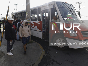 Transporters are circulating on flooded streets in the Colonia Culturas de Mexico in Chalco, State of Mexico, on August 20, 2024, where seve...